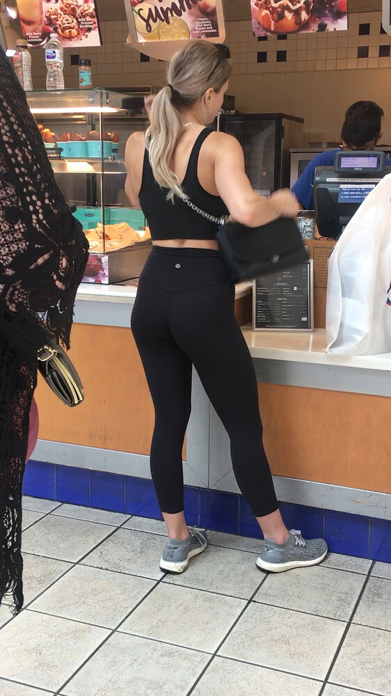 Fit blonde standing in line wearing Lululemon - Spandex, Leggings ...