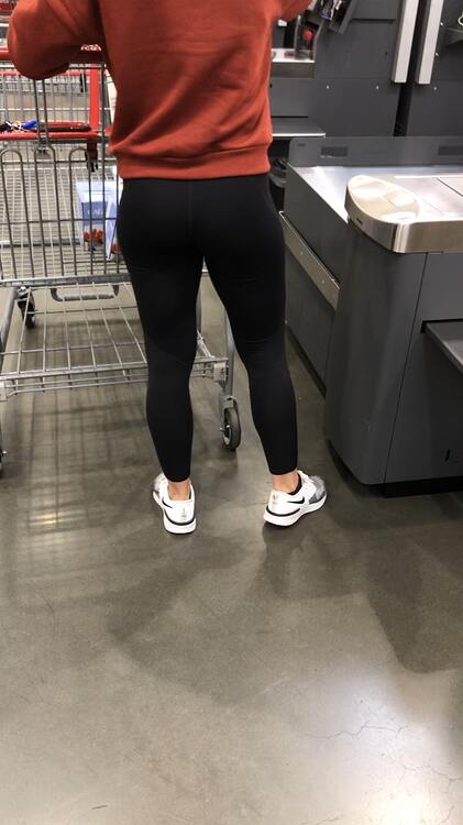 Brunette doing some grocery shopping with her yoga pants on - Spandex ...