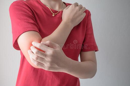 woman-scratching-her-elbow-hand-white-wall-background-104808221