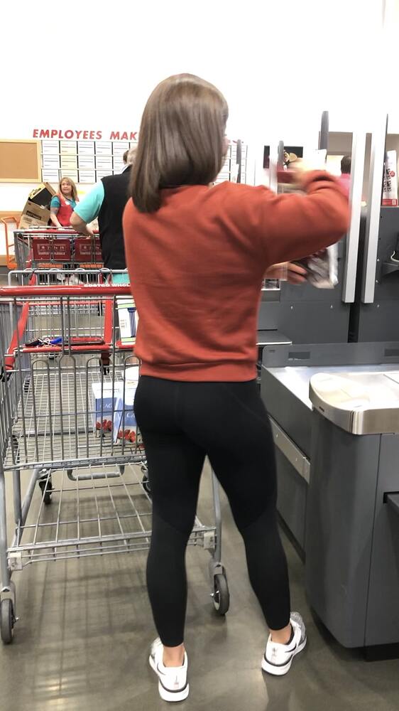 Brunette doing some grocery shopping with her yoga pants on - Spandex ...