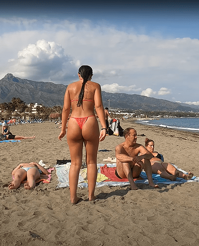amazing girl in thong with her parents at the beach