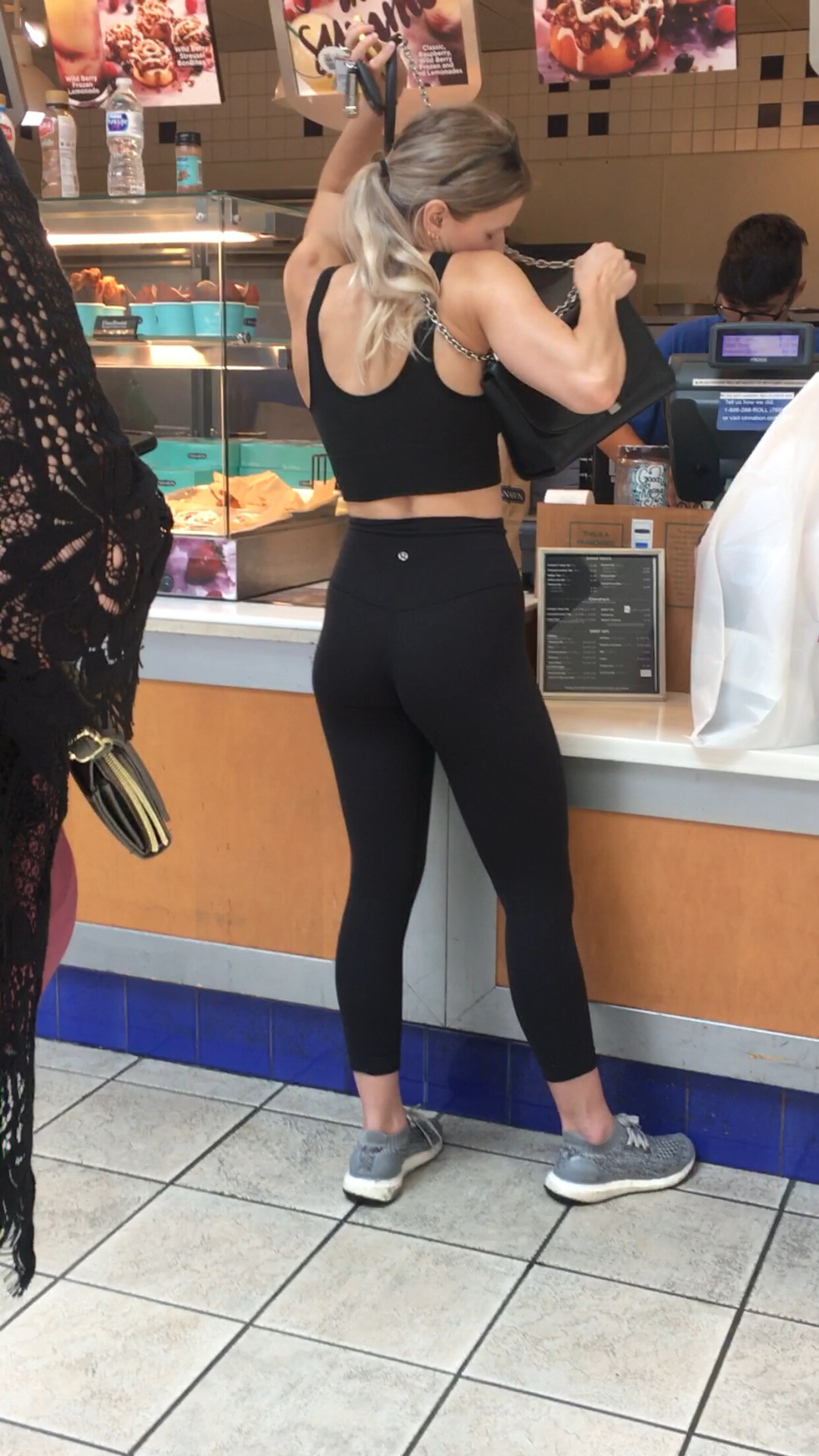 Fit blonde standing in line wearing Lululemon - Spandex, Leggings ...