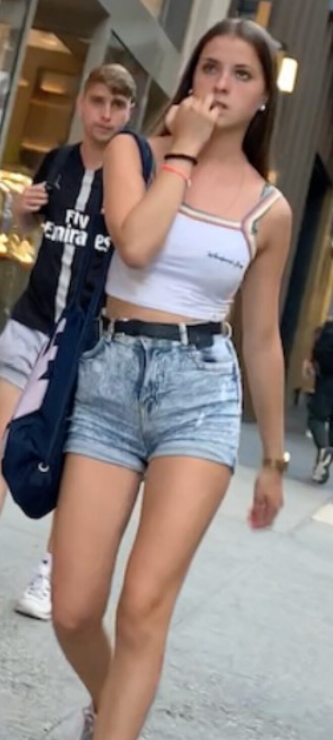 Teen with a tight ass in jeans shorts walking (faceshot included